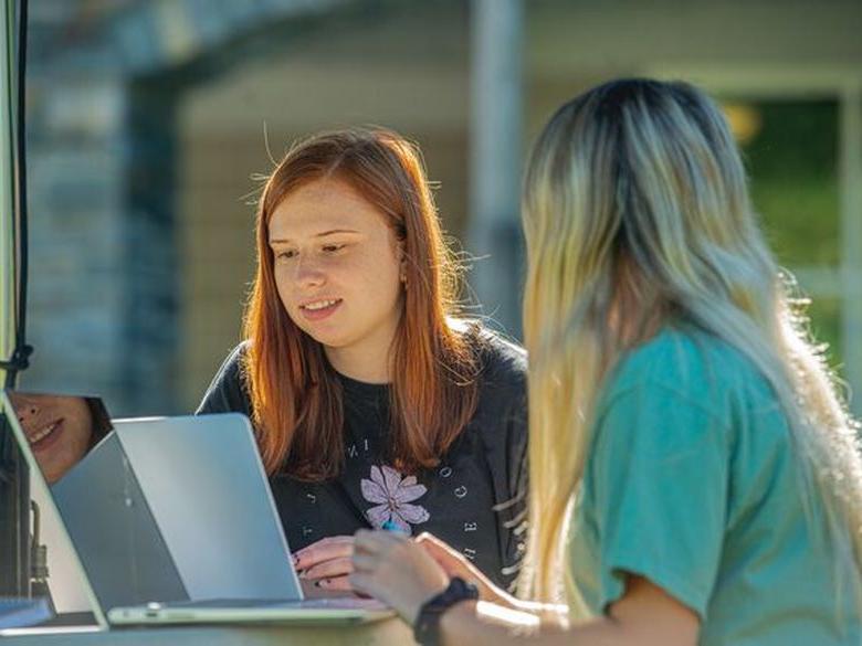 student looking at laptop